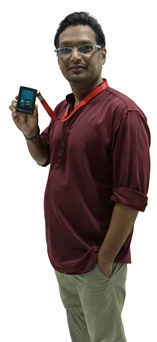 Prof. Sunil Maurya, founder of imbeddeX, holding a TAMS device